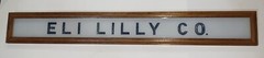 Vintage Eli Lilly Co. Milk White Glass Sign in Frame 6 3/4″ x 4 3/4″ GS00329